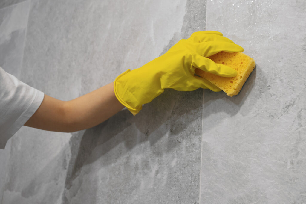 side view woman cleaning home